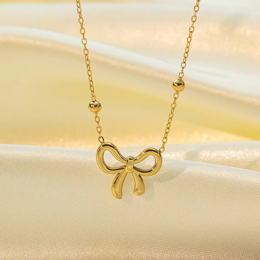 Gold bow necklace with adjustable 41-50cm titanium steel cross chain, European fashion design