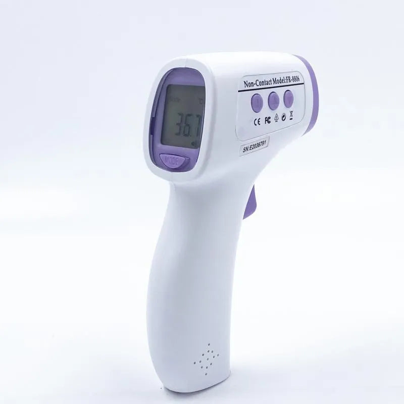 White digital thermometer displaying temperature reading on LCD screen