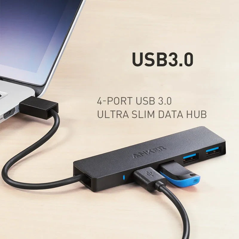 Black Anker USB 3.0 hub with four ports and a 20cm cable on a desk.