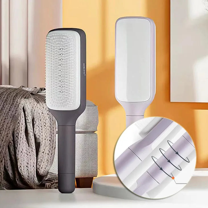 Purple self-cleaning hair brush with telescopic handle showing rotating mechanism and comb teeth