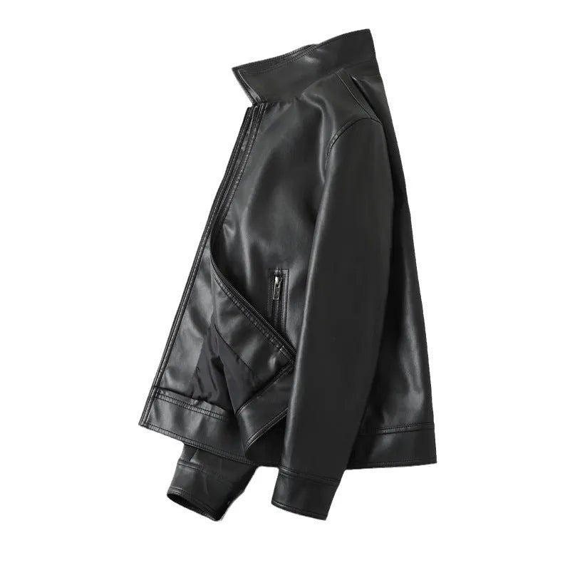 Men's black PU leather jacket with windproof design, loose fit, and zipper pockets, shown in a casual setting.