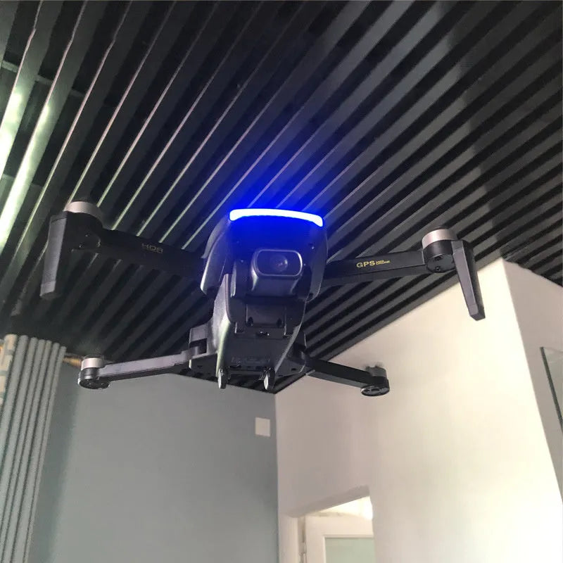 Black folding remote control drone with brushless motor, 4K HD camera, GPS, 4-channel handle remote, and plastic body.