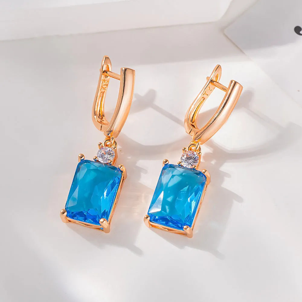 Pair of square geometric earrings with quadrilateral design in gold or silver electroplated finish on copper