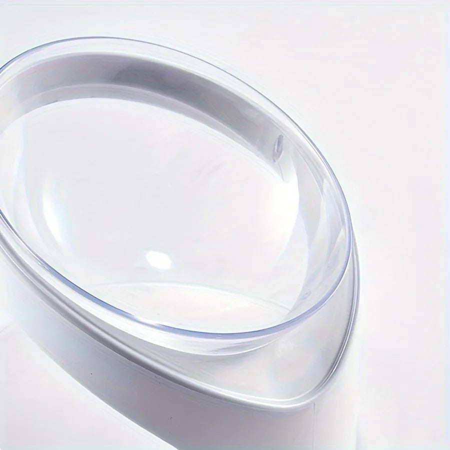Clear elevated cat food bowl with 15-degree tilt angle on white surface