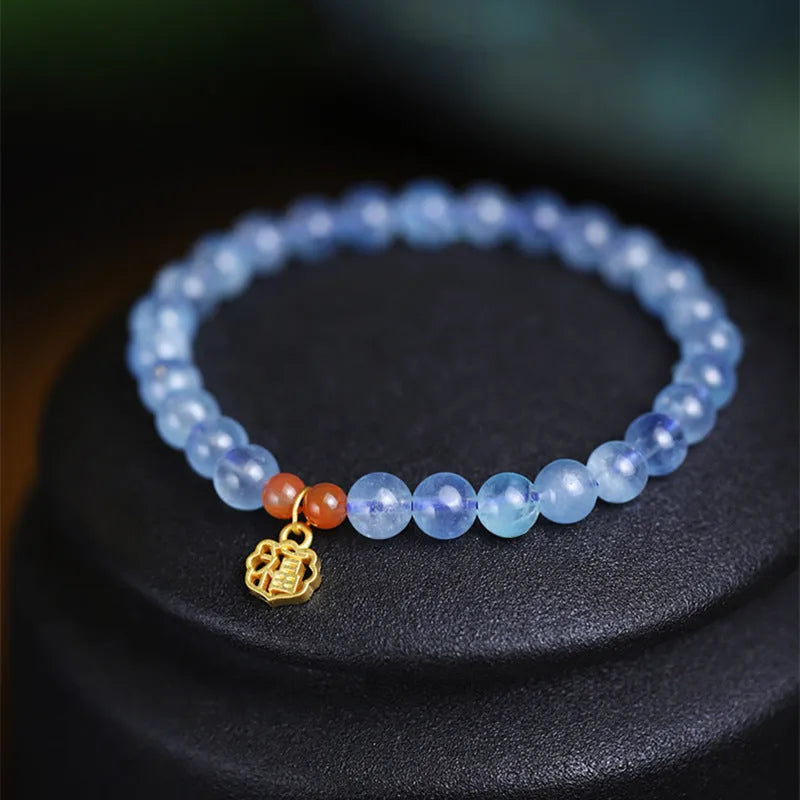 Ice transparent aquamarine crystal bead bracelet with 8mm round beads and sequin detailing