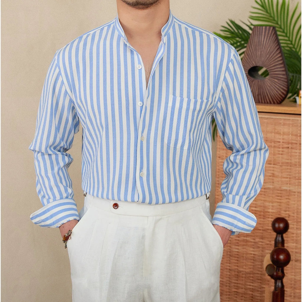 Blue and white seersucker striped long sleeve shirt with loose lapel collar on hanger