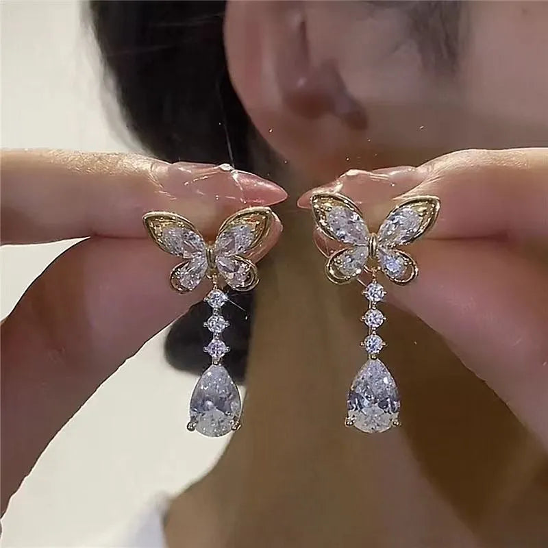 Women's bow-shaped stud earrings with platinum colour electroplated finish on zinc alloy