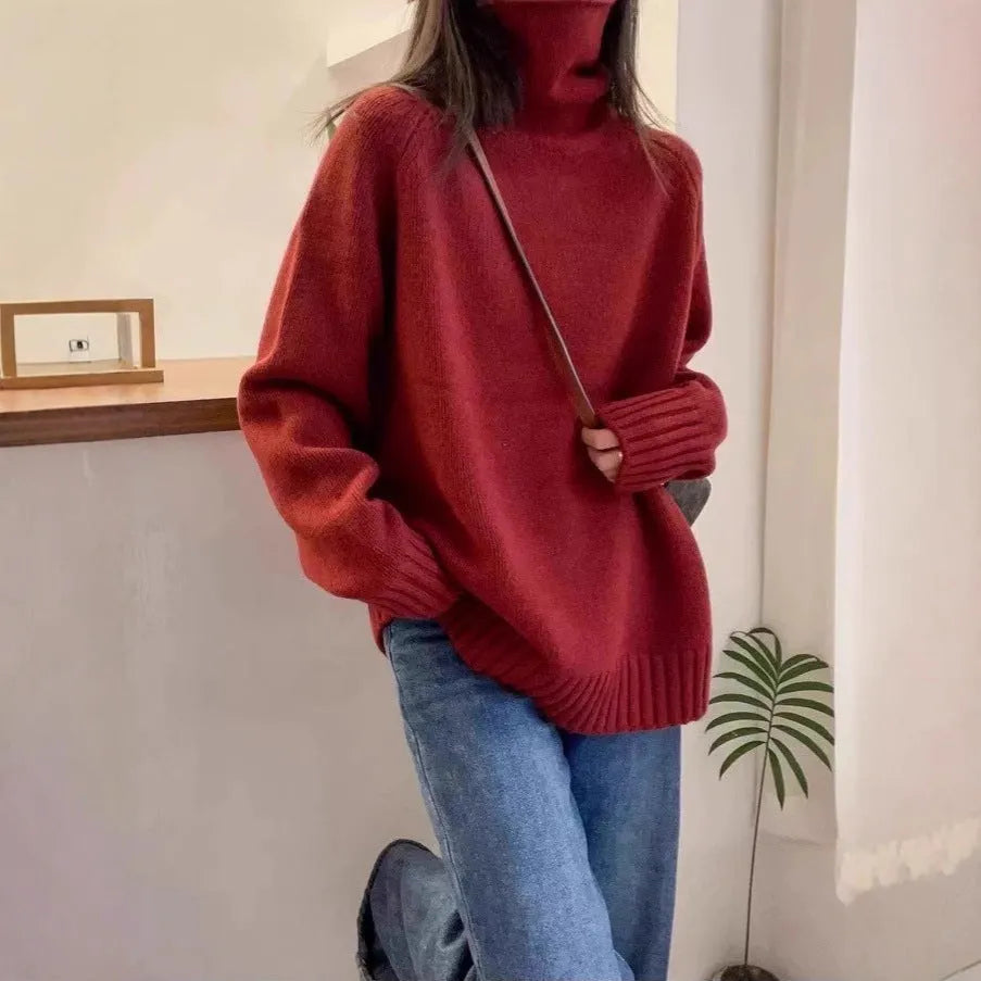 Women's loose-fit grey turtleneck sweater with thick curling pile collar, made of polyester mesh fabric.