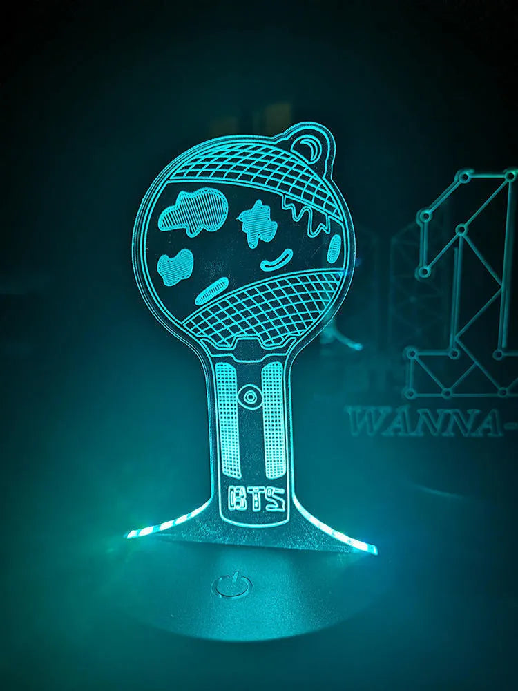 BTS-themed acrylic light-up display stand holding BTS Light 101 Tower Gem collectible