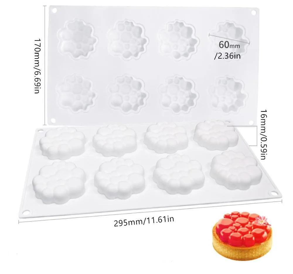 Round silicone cake mould with 8 bubble tower pattern design on a kitchen worktop.