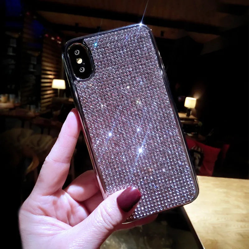 Silver silicone full diamond phone case for iPhone on a table