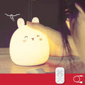 Silicone cute rabbit-shaped rechargeable night light showing colour change options and compact size.