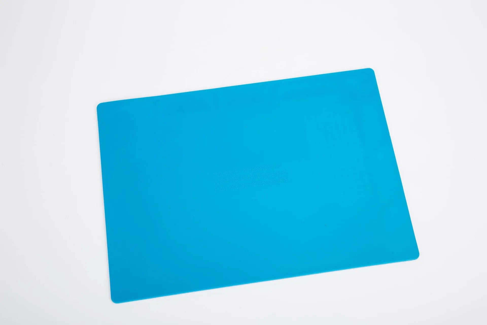 Blue silicone watch repair mat for anti-slip protection on work desks