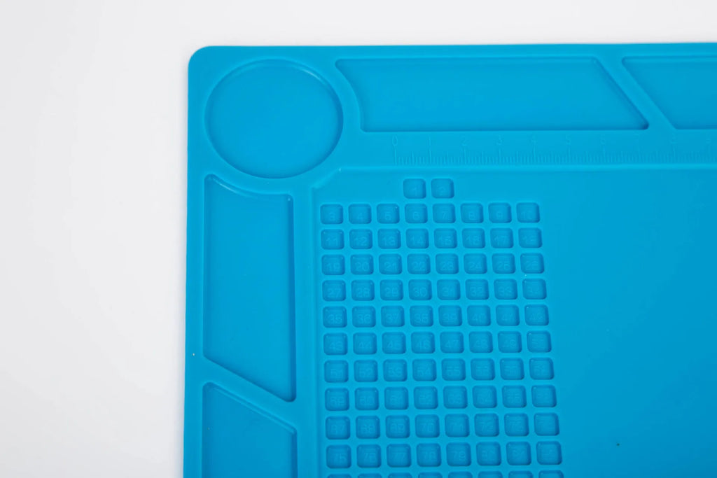 Blue silicone watch repair mat for anti-slip protection on work desks