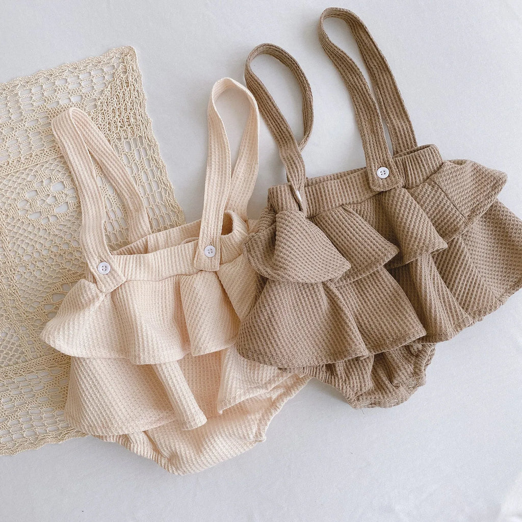 Baby romper with triangle climb sling design and pleated lotus leaf detail for 0-2 year olds