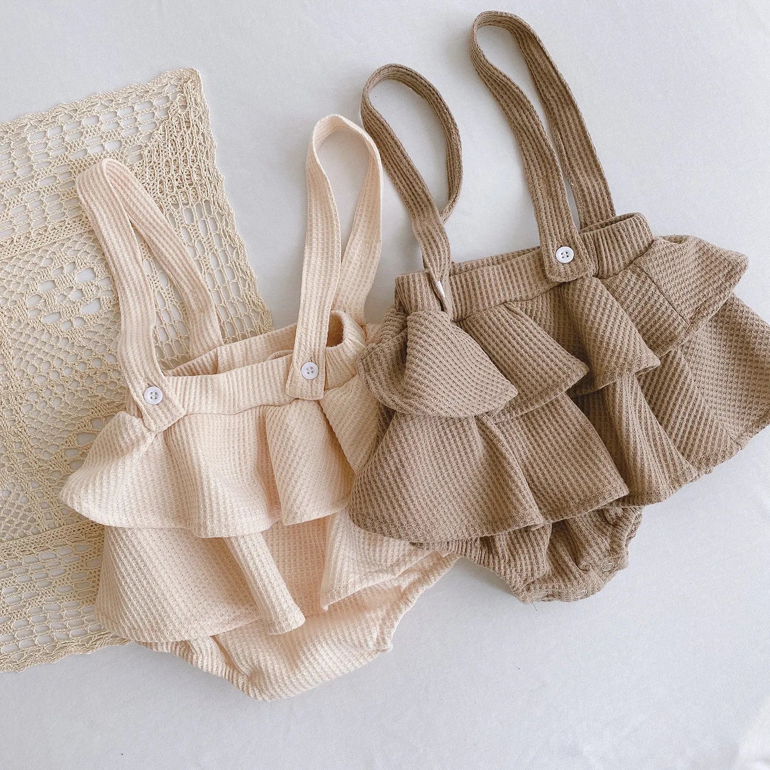 Baby romper with triangle climb sling design and pleated lotus leaf detail for 0-2 year olds