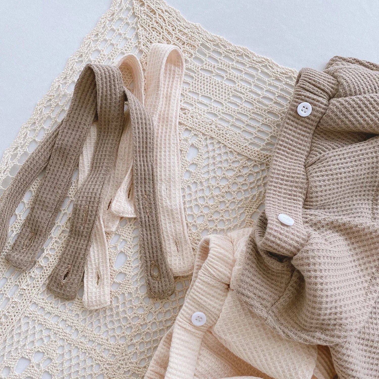 Baby romper with triangle climb sling design and pleated lotus leaf detail for 0-2 year olds