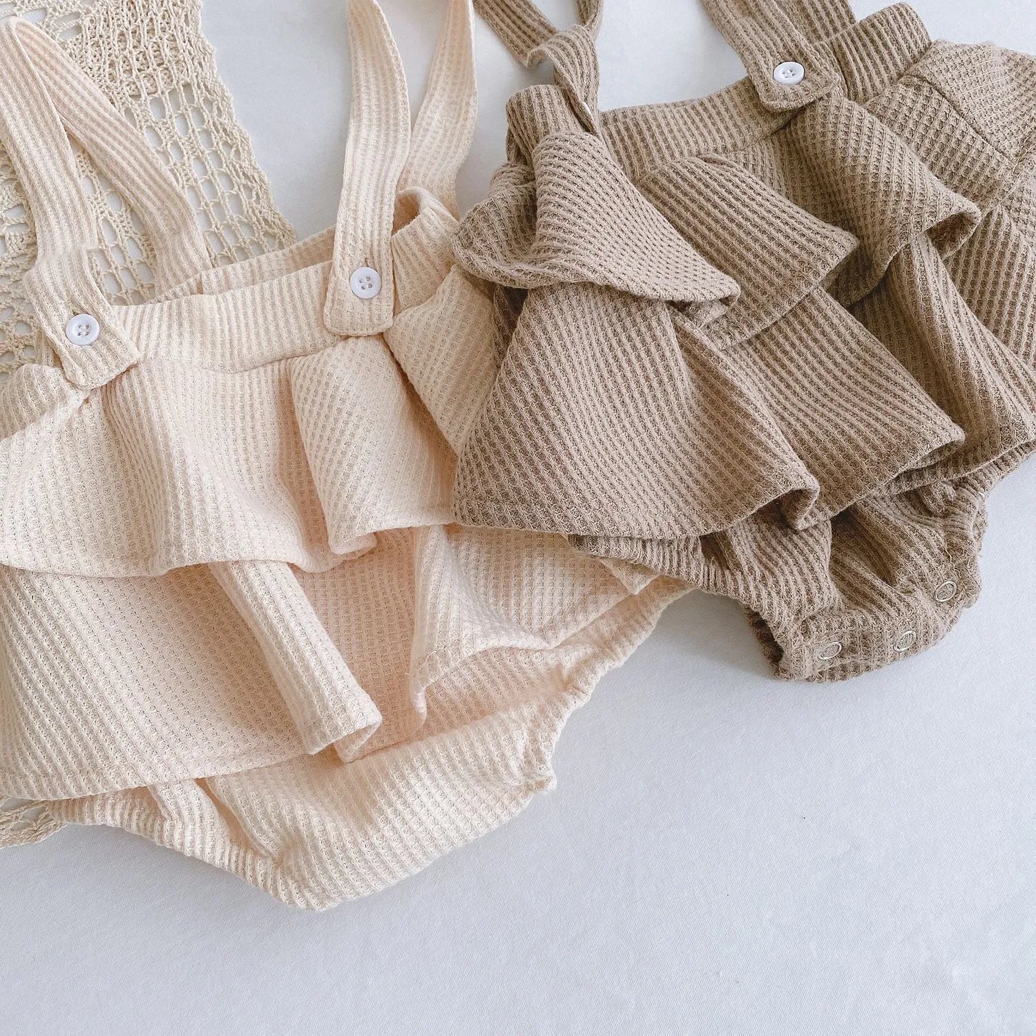 Baby romper with triangle climb sling design and pleated lotus leaf detail for 0-2 year olds
