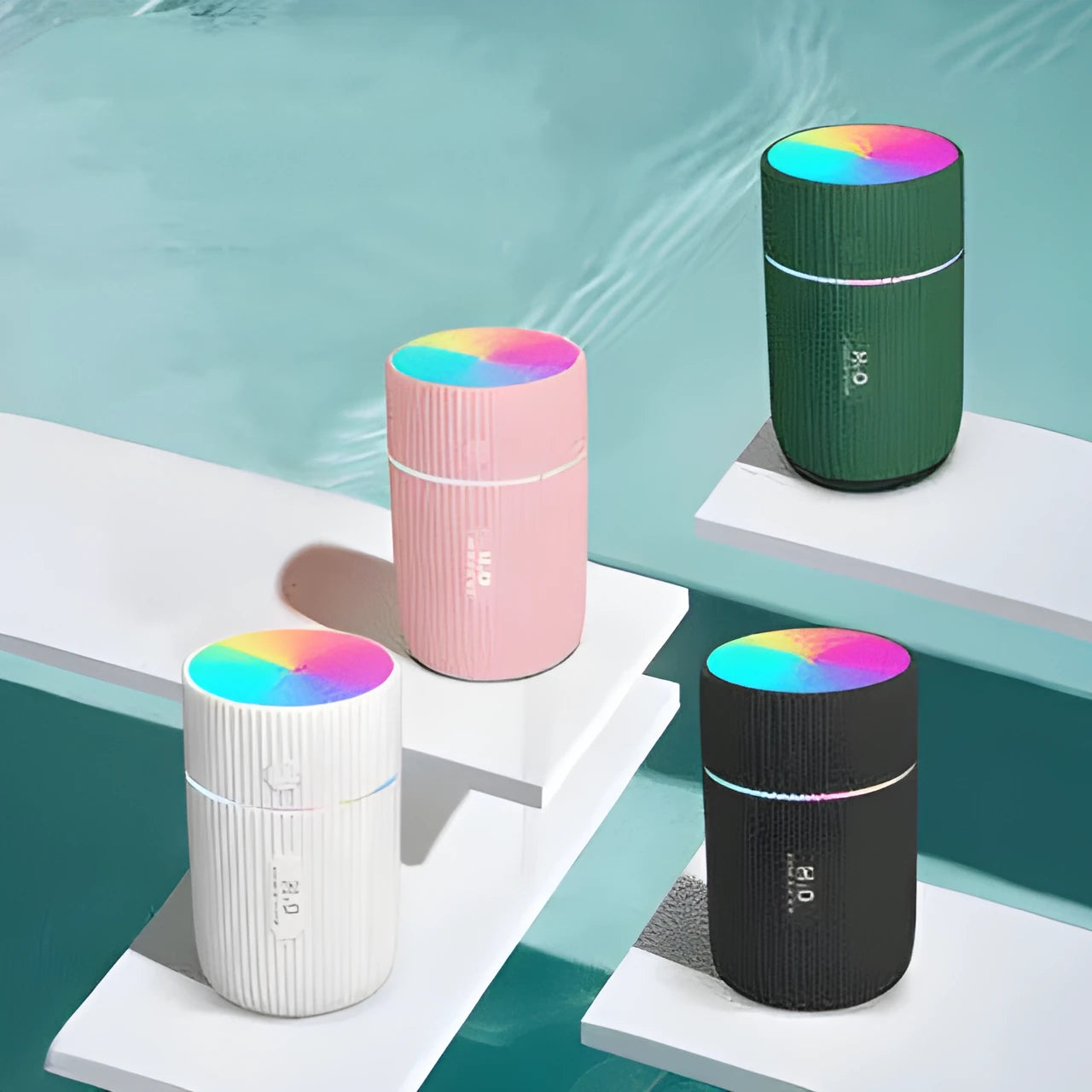 Compact black portable USB humidifier and essential oil diffuser for car or desk use.