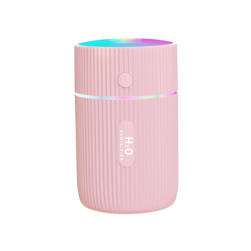 Compact black portable USB humidifier and essential oil diffuser for car or desk use.