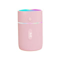 Compact black portable USB humidifier and essential oil diffuser for car or desk use.