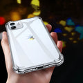 Transparent white silicone shockproof case fitted on an iPhone showing precise cutouts for camera and ports.