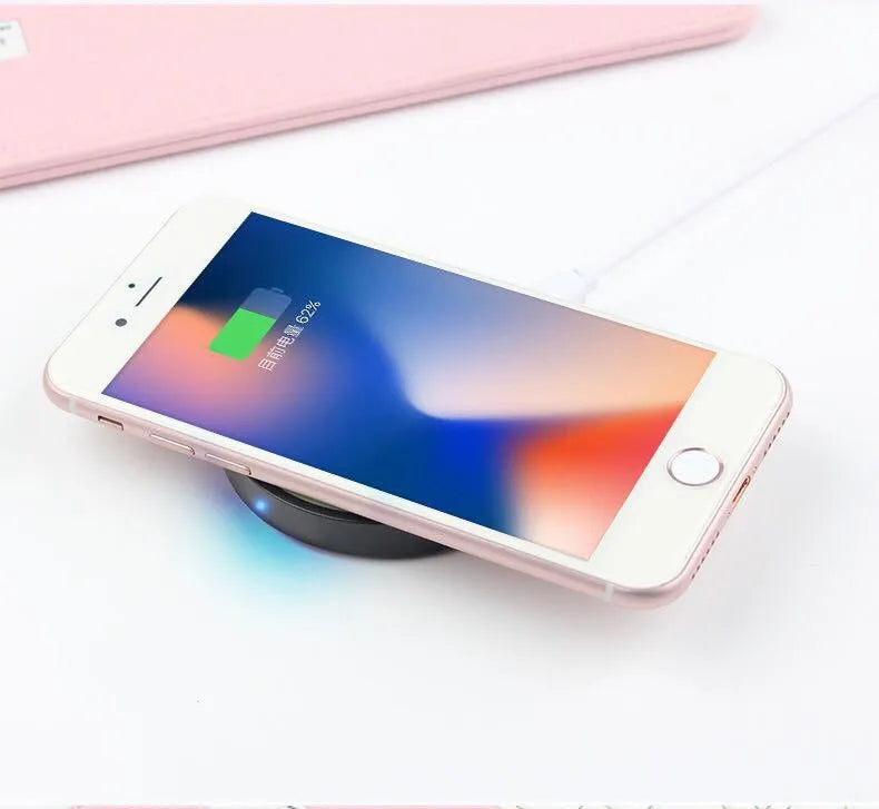 Square wireless phone charger in multiple colours showing Qi logo and 5W output specifications