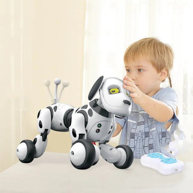Smart robot dog toy with remote control on a table.