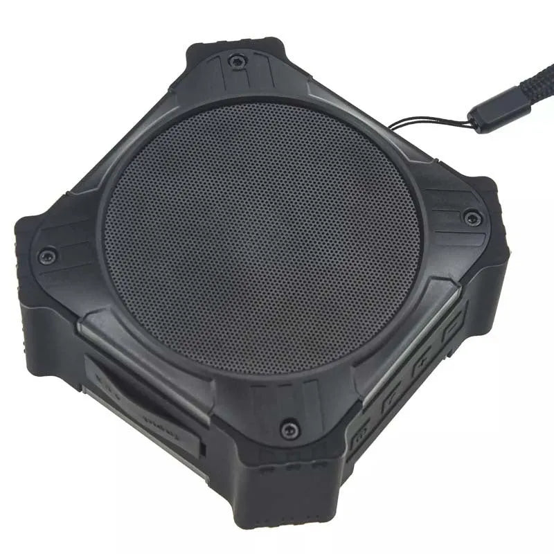 Black waterproof portable Bluetooth speaker showing compact 101x101x47mm dimensions with wrist strap attached