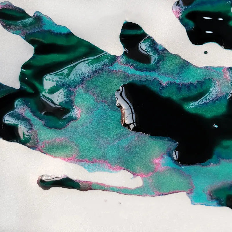 Bottle of sheen gradient fountain pen ink with gold powder particles in Red Tide or Truffle colour.