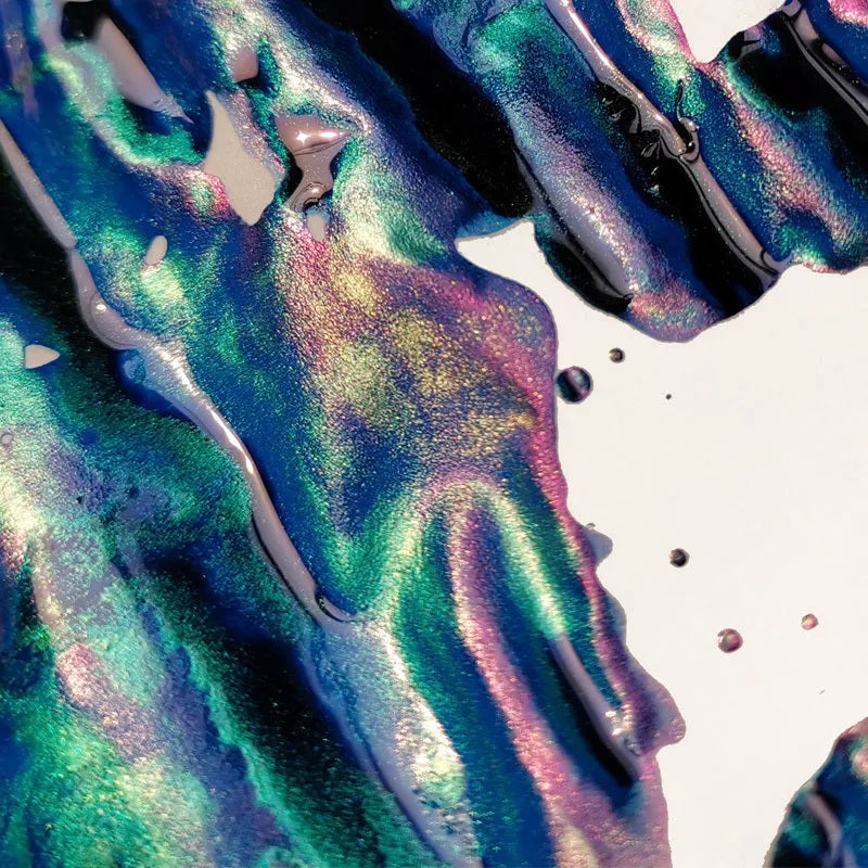 Bottle of sheen gradient fountain pen ink with gold powder particles in Red Tide or Truffle colour.