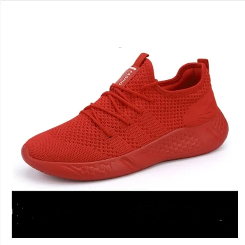 Men's black and white mesh sneakers with round toe design and lace-up closure on neutral background