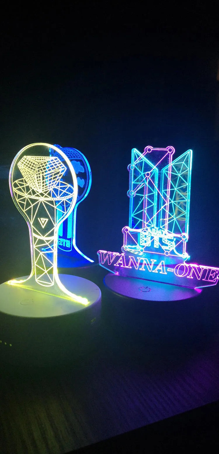 BTS-themed acrylic light-up display stand holding BTS Light 101 Tower Gem collectible