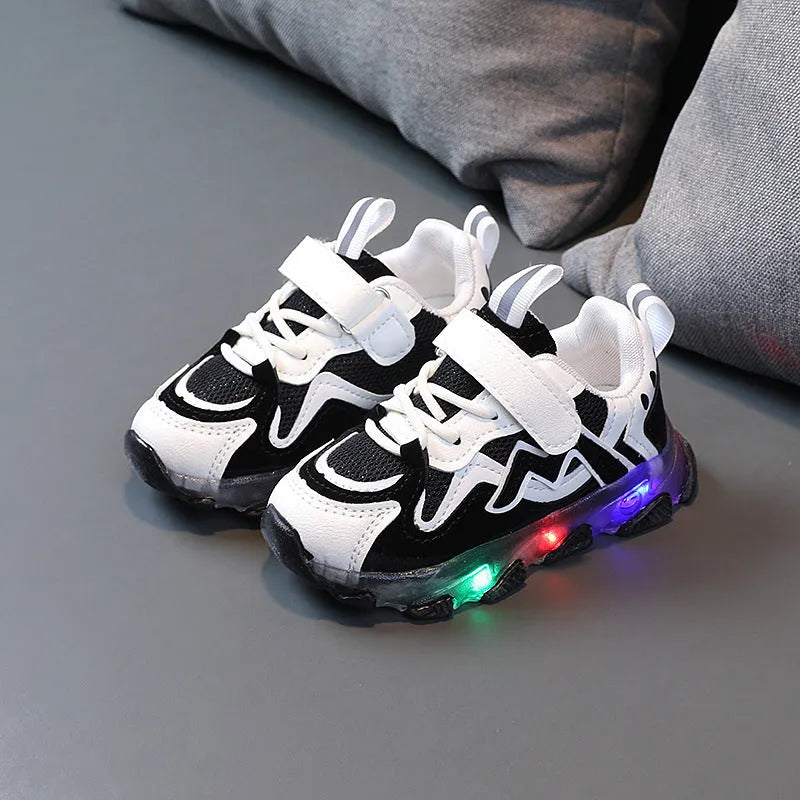 Kids breathable mesh Velcro sneakers in black colour showing rubber sole and adjustable fastening