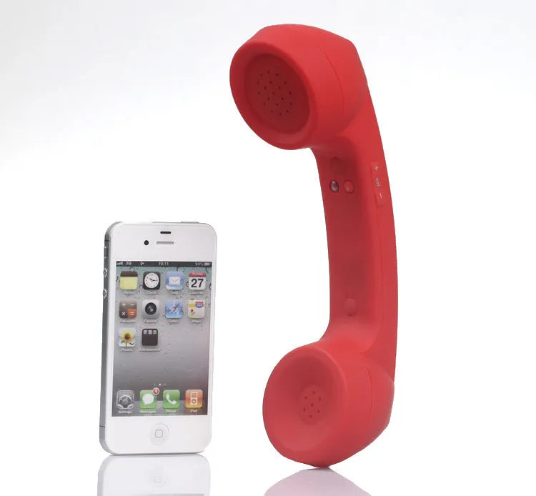 Bluetooth wireless headset in black with hanging ear design, showing microphone and charging port