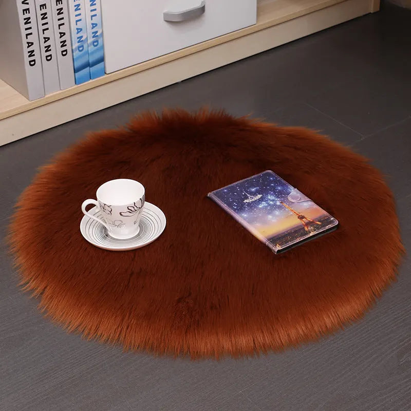 Round beige wool plush carpet floor mat on a wooden floor.