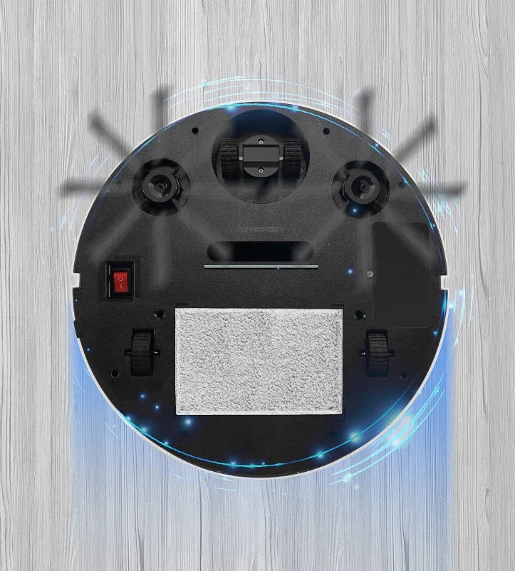 Golden and silver robotic vacuum cleaner with remote control on a hardwood floor.
