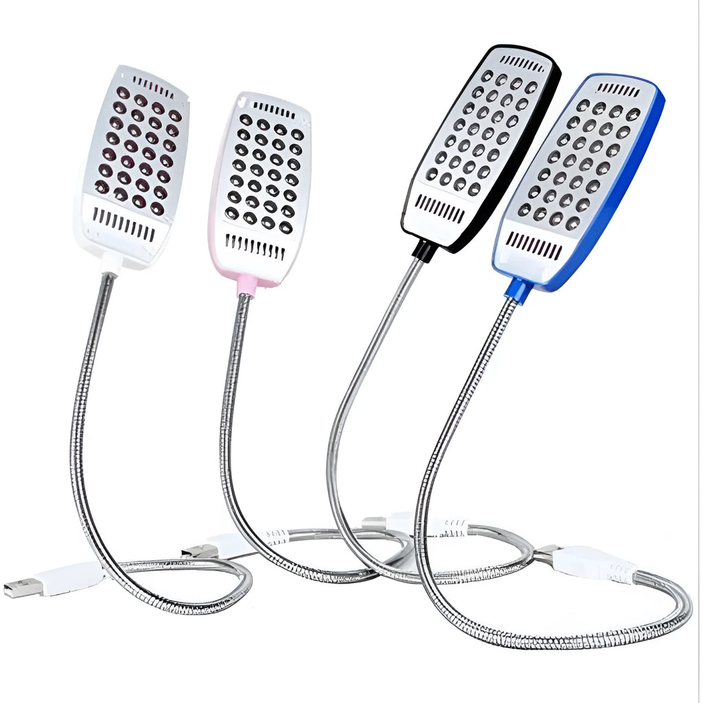 Black flexible USB desk lamp with LED light bent over a laptop keyboard.