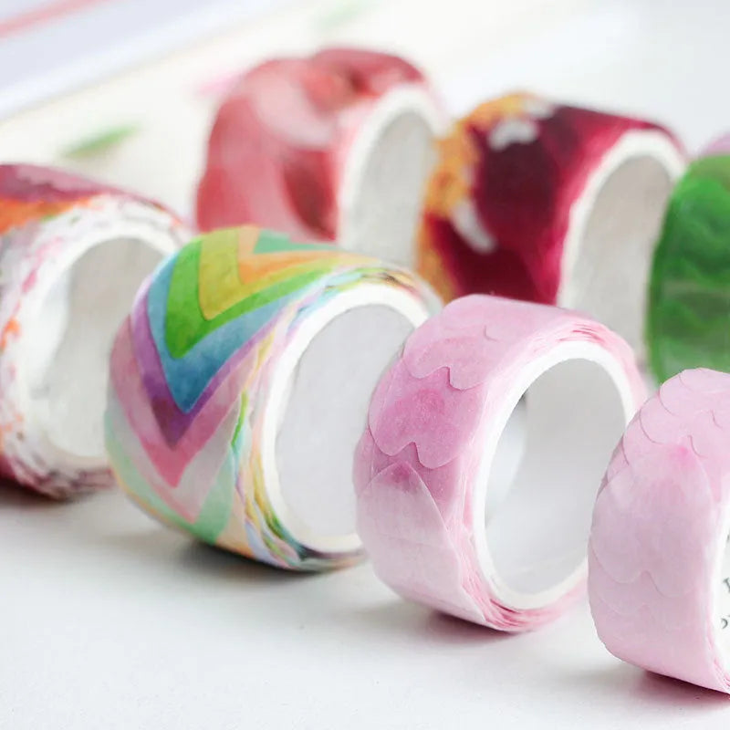 Clover and paper decorative washi tape roll showing blue, cherry blossom, violet and mixed colour patterns