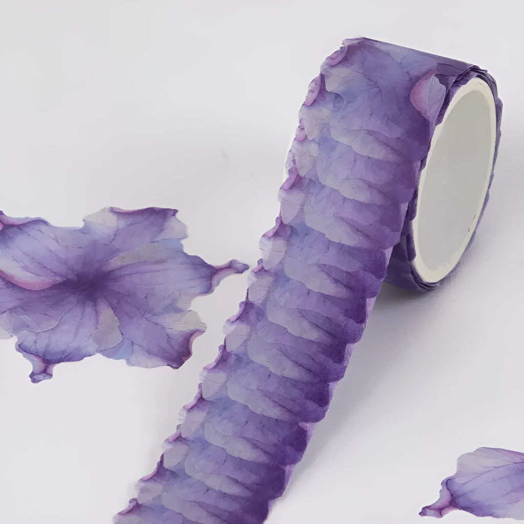 Clover and paper decorative washi tape roll showing blue, cherry blossom, violet and mixed colour patterns