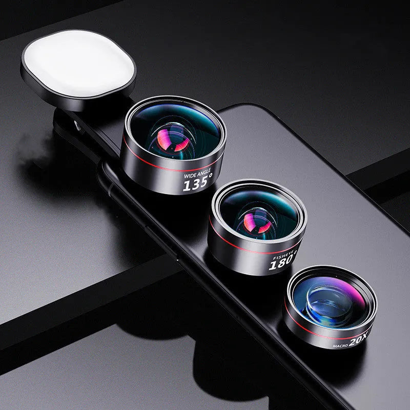Universal smartphone clip with attached fill light and selection of wide angle, macro, and fish eye camera lenses.