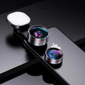 Universal smartphone clip with attached fill light and selection of wide angle, macro, and fish eye camera lenses.