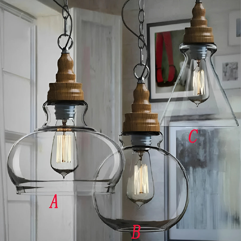 Single head glass pendant light with wood grain finish hanging from ceiling on adjustable cable.