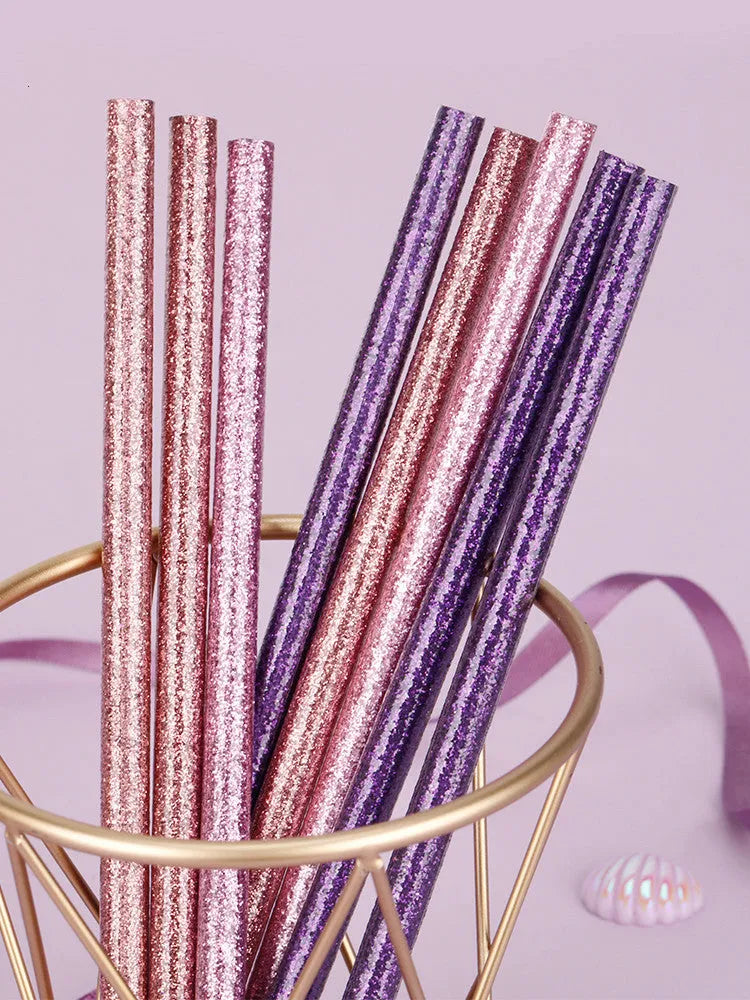 Display box open showing mixed colour HB pencils including purple glitter and pale pink styles with erasers.