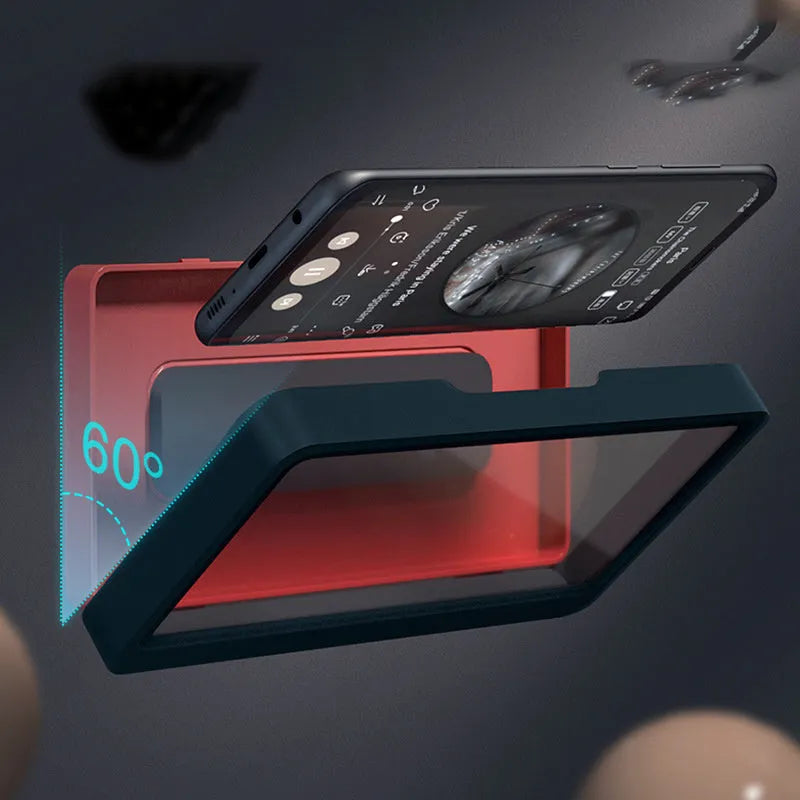 Waterproof bathroom phone holder mounted on wall with mobile device inserted, showing non-marking sticker installation