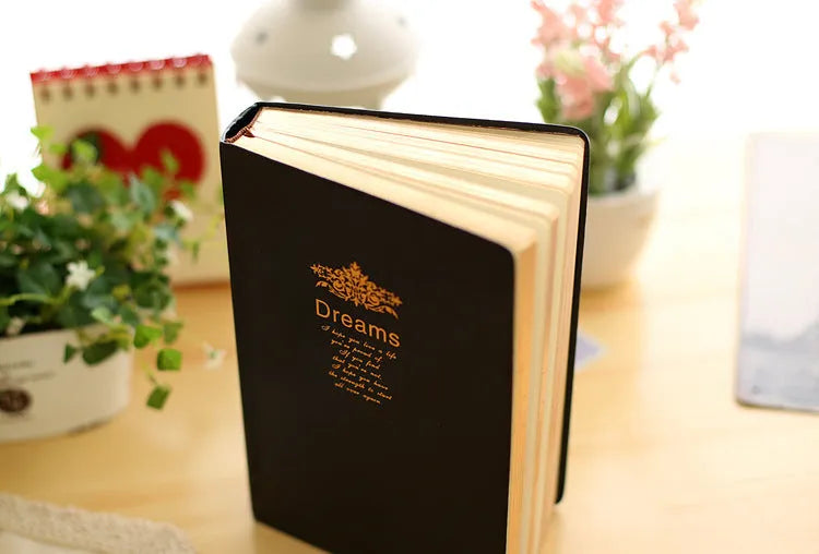 Jingu 25k thick notepad with imitation leather cover, showing large internal page size.