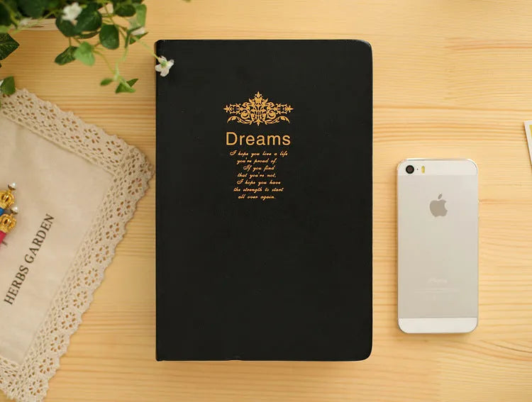 Jingu 25k thick notepad with imitation leather cover, showing large internal page size.