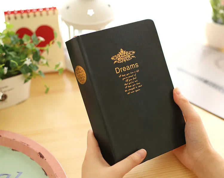 Jingu 25k thick notepad with imitation leather cover, showing large internal page size.