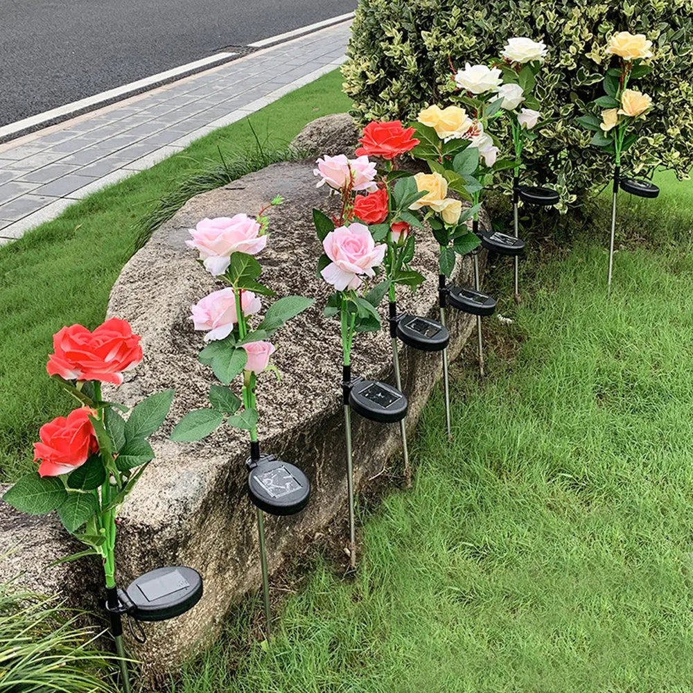 Outdoor solar garden light with three decorative rose heads on 80cm ground stake