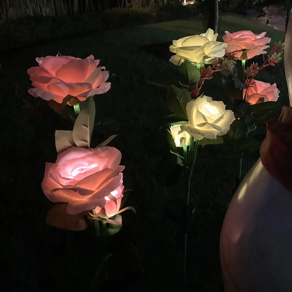 Outdoor solar garden light with three decorative rose heads on 80cm ground stake
